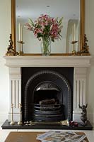 Vase of Lilies on mantlepiece