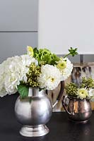 Flower arrangement in metal jug