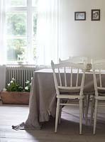 White chair at dining table