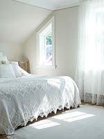 Bed with lace bedspread
