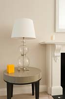 Glass lamp on side table
