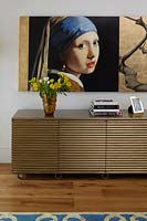 Modern sideboard and reproduction of painting by Johannes Vermeer