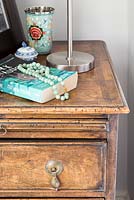Accessories on vintage chest of drawers