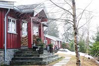 Traditional wooden cabin in pine forest
