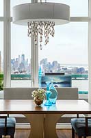 Modern chandelier above dining table