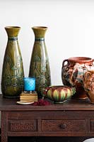 Patterned ceramics on vintage cabinet