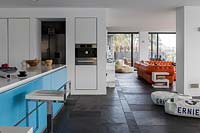 Open plan living space with slate flooring