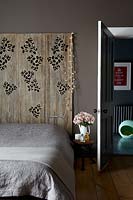 Patterned panels behind bed