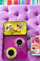 Coffee and biscuits on colourful tray