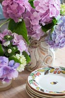 Vase of Hydrangea flowers on kitchen table