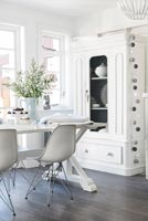 White cupboard in dining area