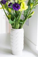 Eustoma flowers in patterned vase