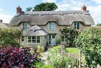 Thatched cottage and garden in summer