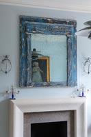 Mirror above fireplace