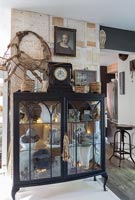 Collectibles in black display cabinet