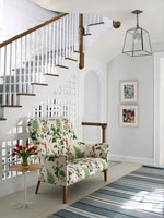 Compact sofa by staircase