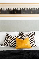 Zebra print cushions on bed