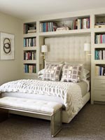Bookshelves above bed
