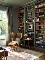 Leather chair beside bookcase
