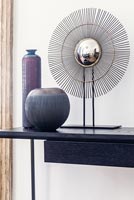 Modern accessories on console table
