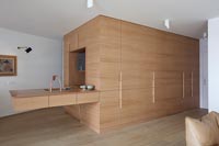 Open plan kitchen area with concealed storage