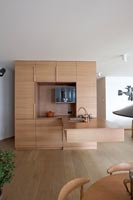 Open plan kitchen area with concealed storage