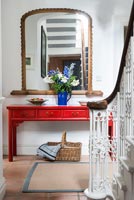 Red cabinet in hallway