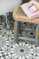 Patterned tiles on bathroom floor