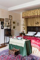 The master bedroom or The Chatelaines room with a Chinese cabinet - Cothay Manor