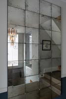 Mirror on staircase wall
