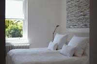 White cushions on bed