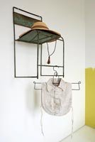 Wall mounted chair used as storage