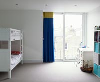 Childs bedroom with colourful curtains