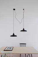 Pendant lights above dining table