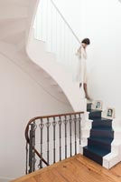 Woman walking down stairs
