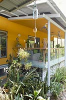 Colourful veranda and tropical planting