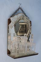 Etched glass mirror shelf with cut glass jars