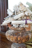 Seashells and scrolls in vintage urn