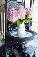 Pink Hydrangea flowers in white pot