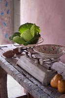 Vintage kitchen scales on rustic console table