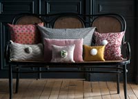 Cushions on cane sofa