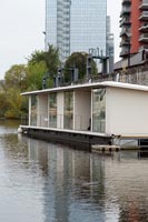 Houseboat in urban setting