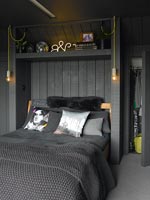 Storage alcove above bed