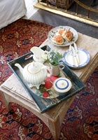 Tea and cakes on coffee table