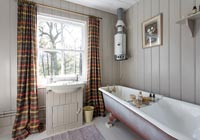 Patterned curtains in bathroom