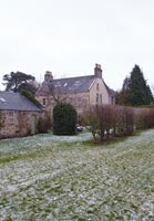 Country house and garden in winter