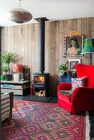 Colourful living room with wood burning stove