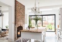 Open plan kitchen with fireplace