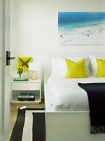 Yellow cushions on bed