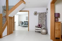 White entrance hall with tiled flooring